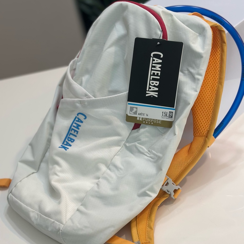 CamelBak Arete 14 Hydration Backpack – 1.5L Reservoir – White/Gold/Blue/Pink